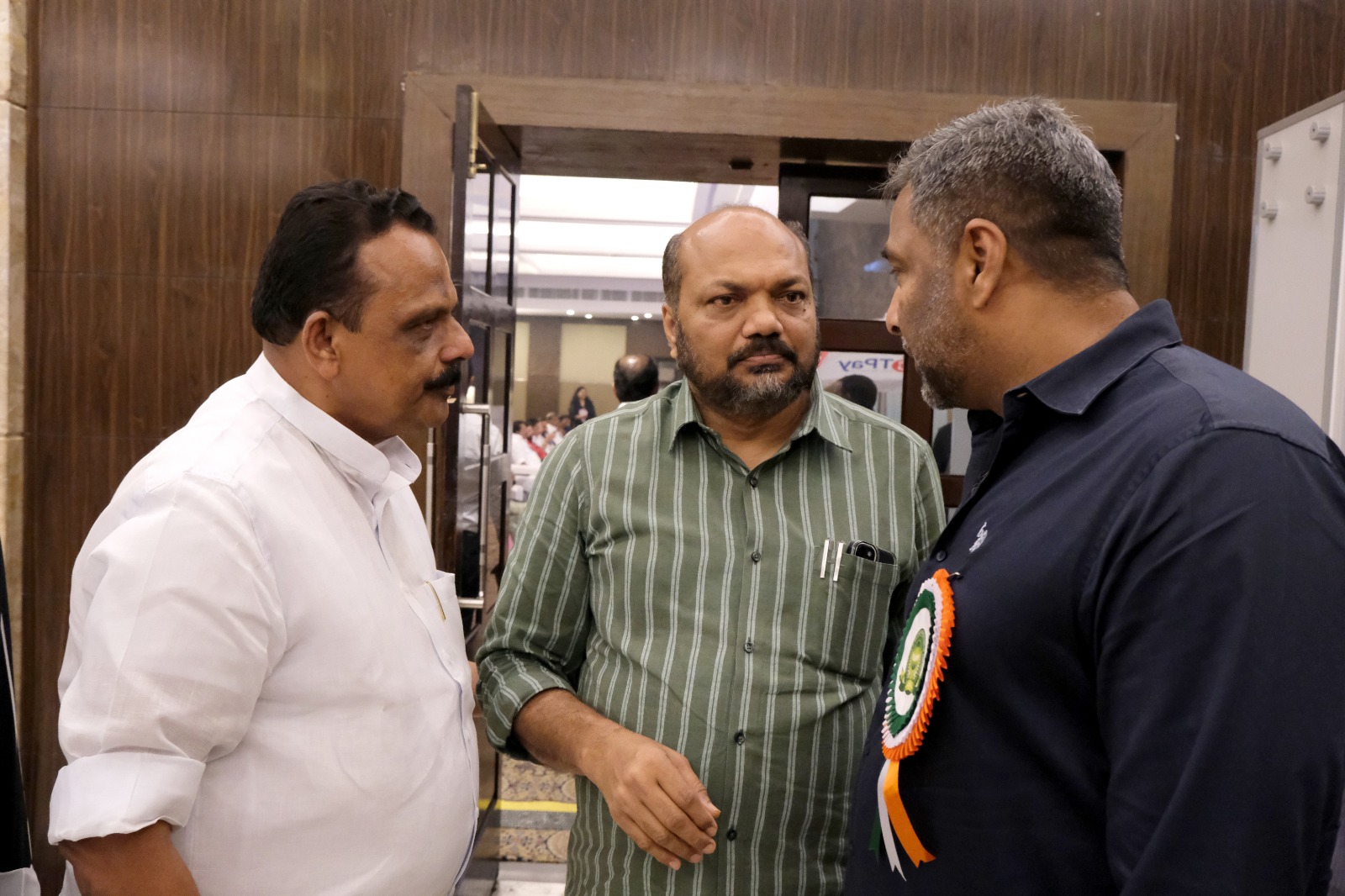 Sabu K. Jacob with Minister P. Rajeev and EVM Managing Director Sabu Jhony at FOMAA Convention 2026
